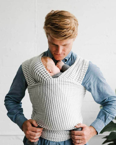 Dad looking down at baby in Natural and Grey Stripe Solly Wrap