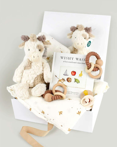 Gift box with stuffed animals, wooden rattles, baby book and pacifiers