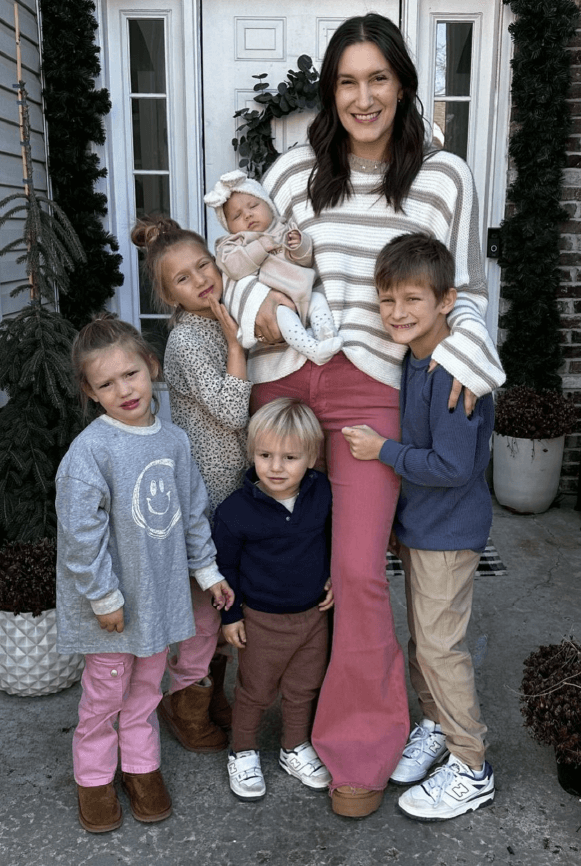 Karrie Locher with 5 children on doorstop smiling