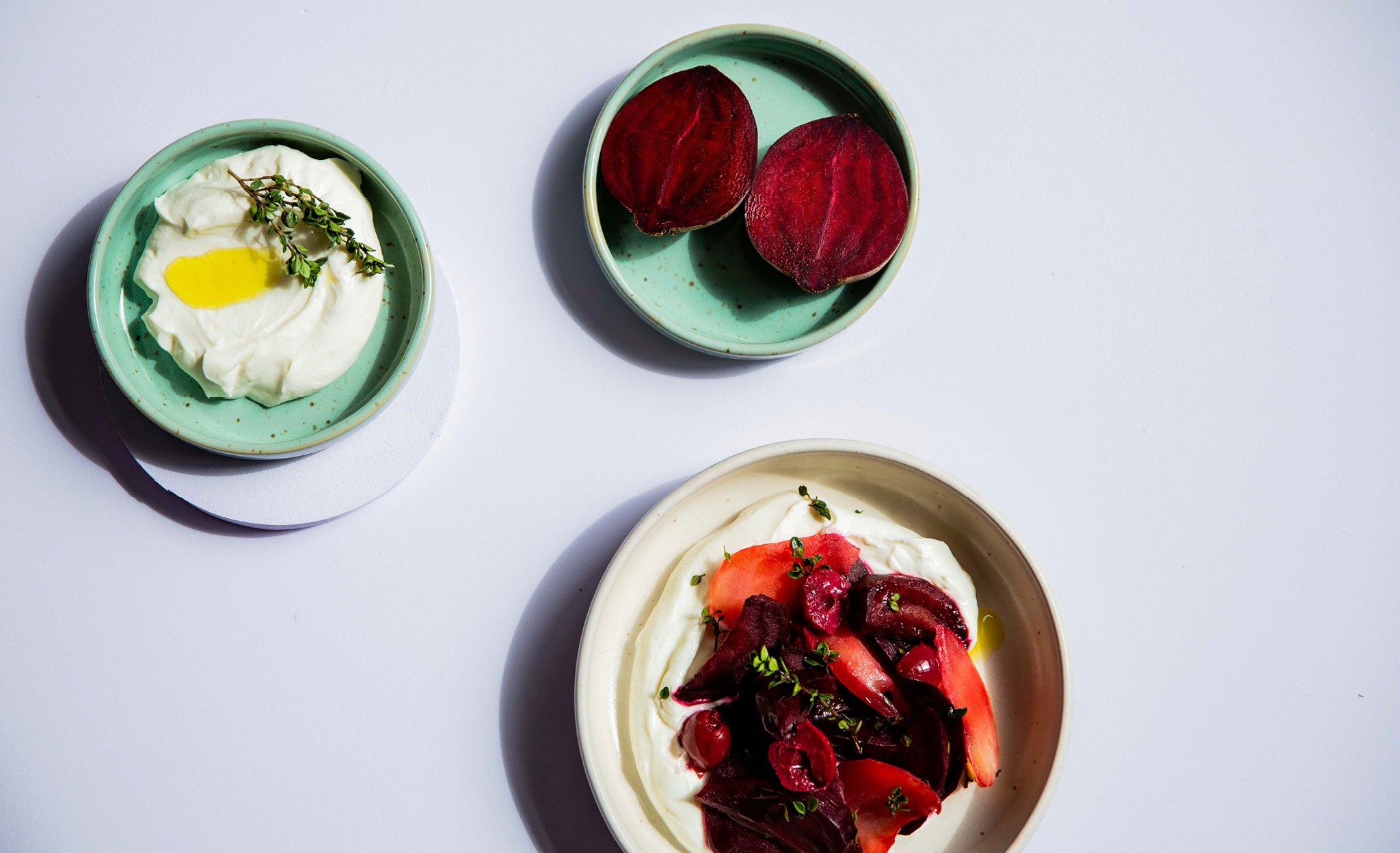 baked beet with cherries on ricotta cream