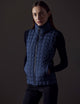 woman wearing blue insulated vest from AETHER Apparel