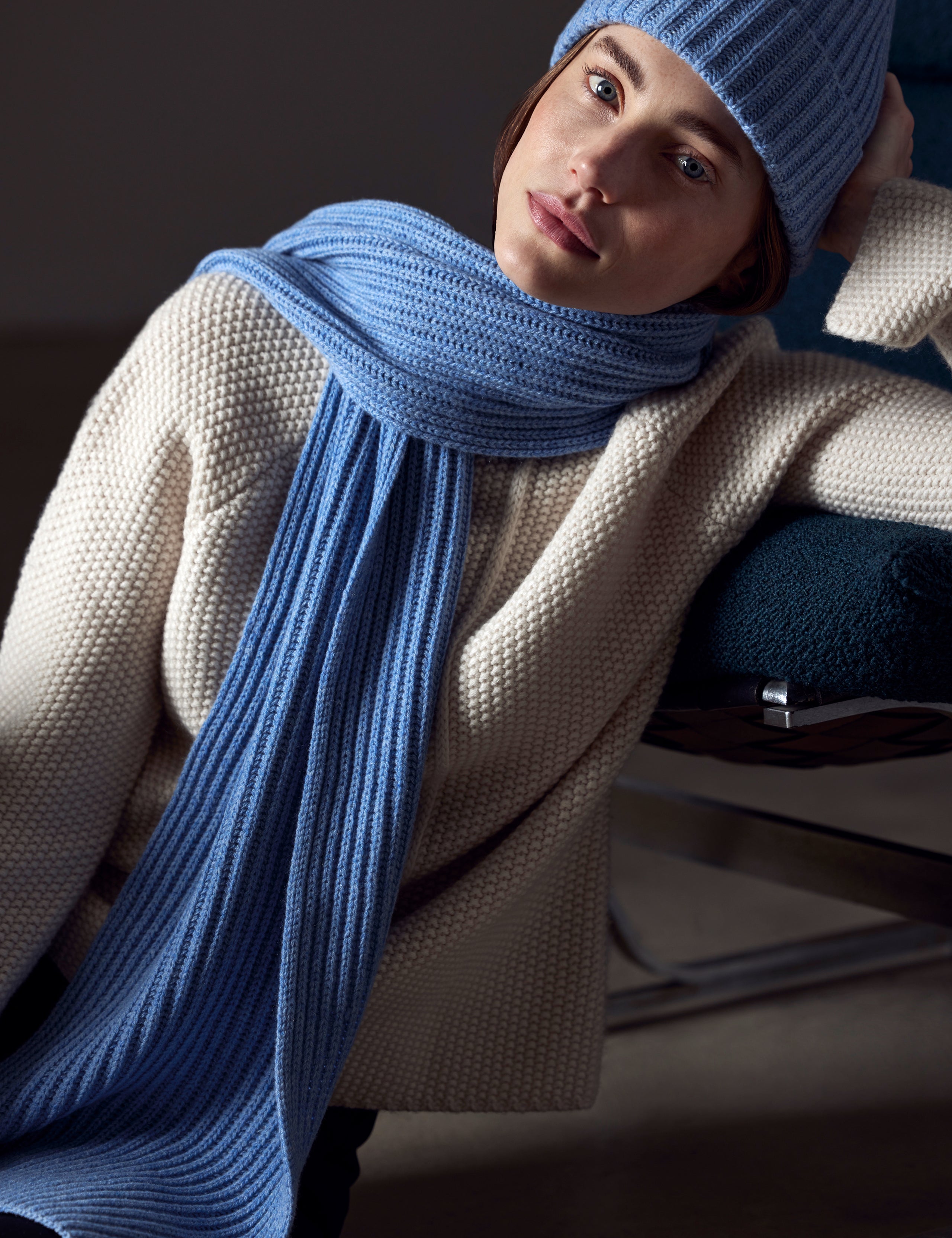woman wearing light blue cashmere scarf from AETHER Apparel