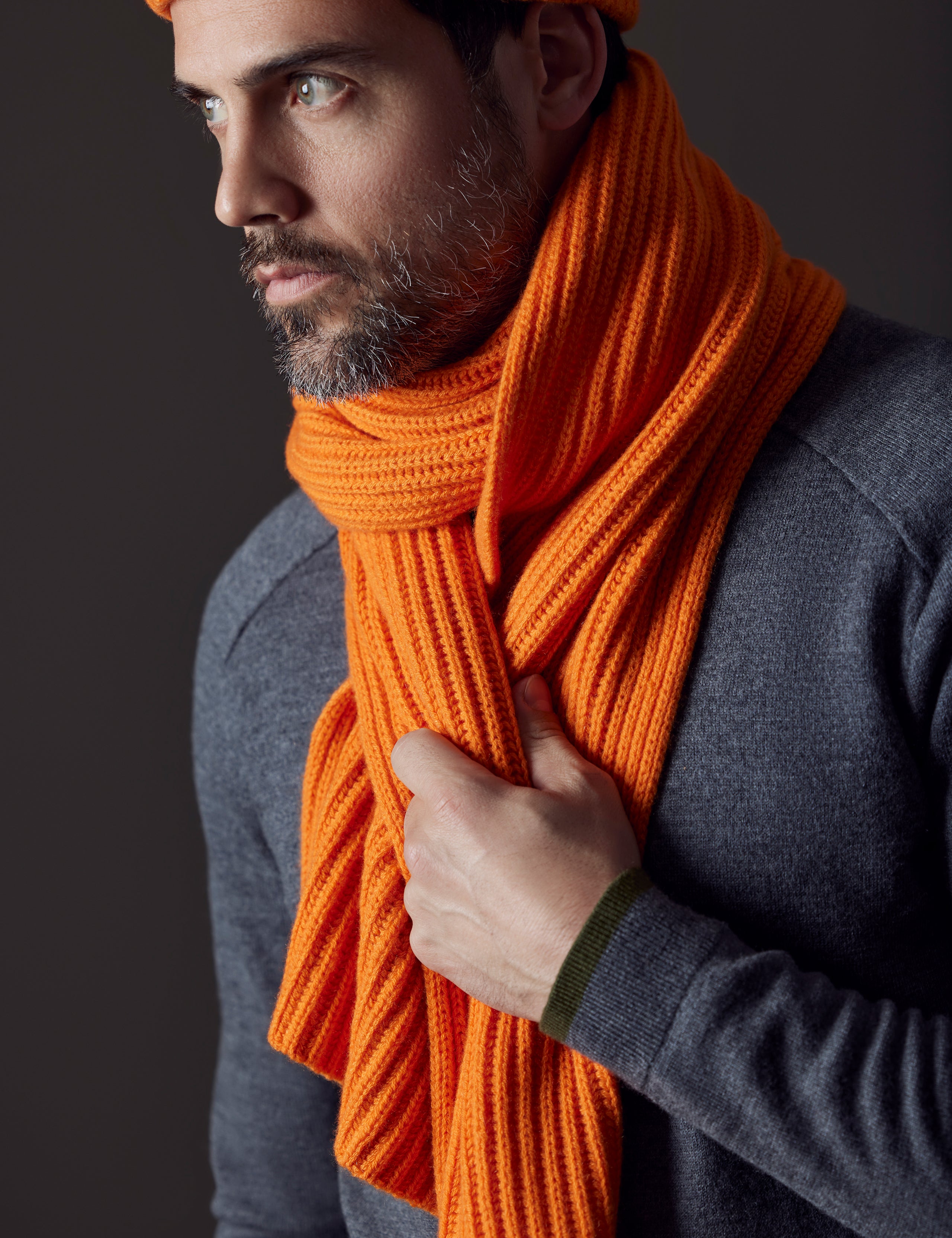 man wearing orange cashmere scarf from AETHER Apparel