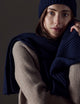 woman wearing dark blue cashmere hat and scarf from AETHER Apparel