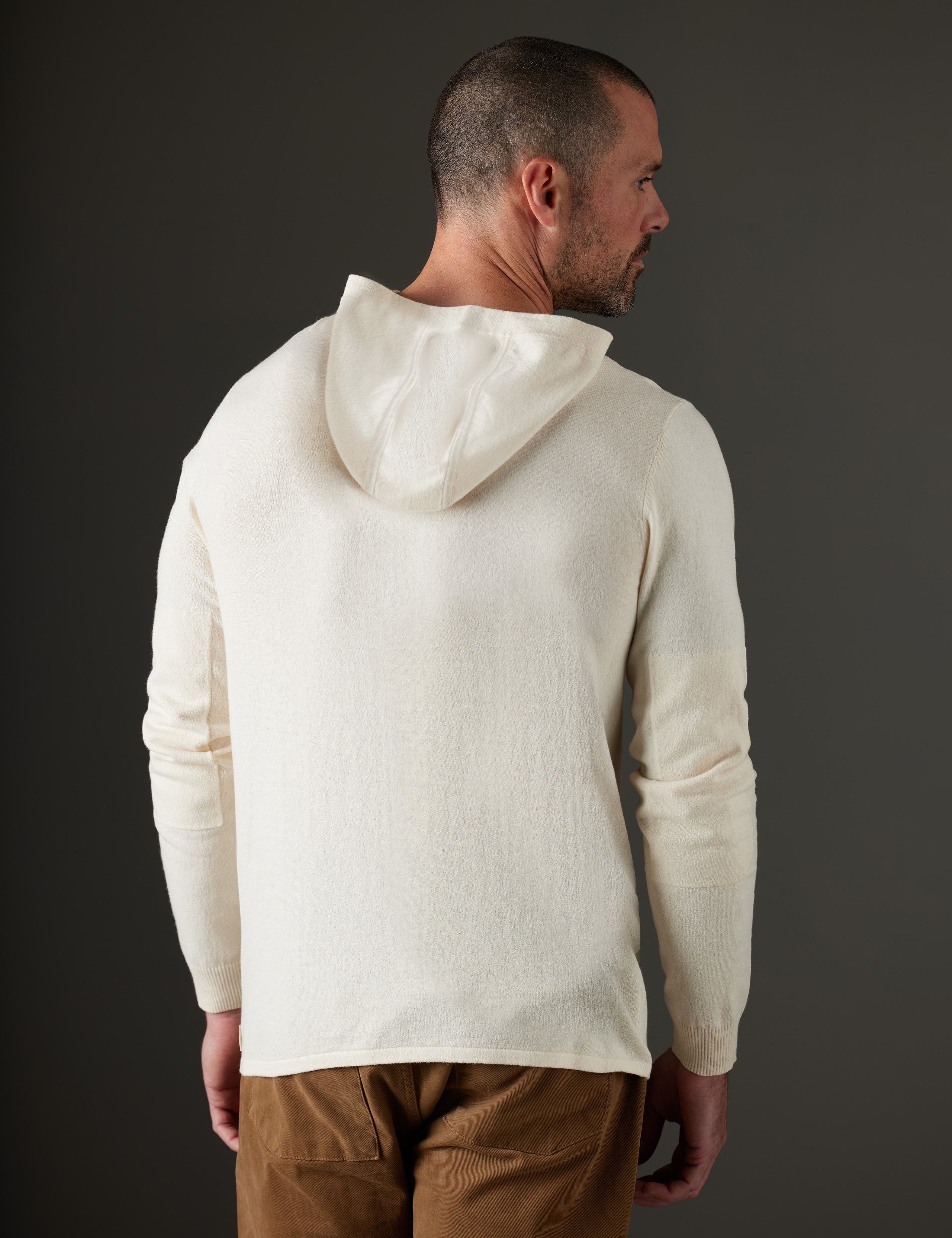 Man wearing beige hooded sweater from AETHER Apparel