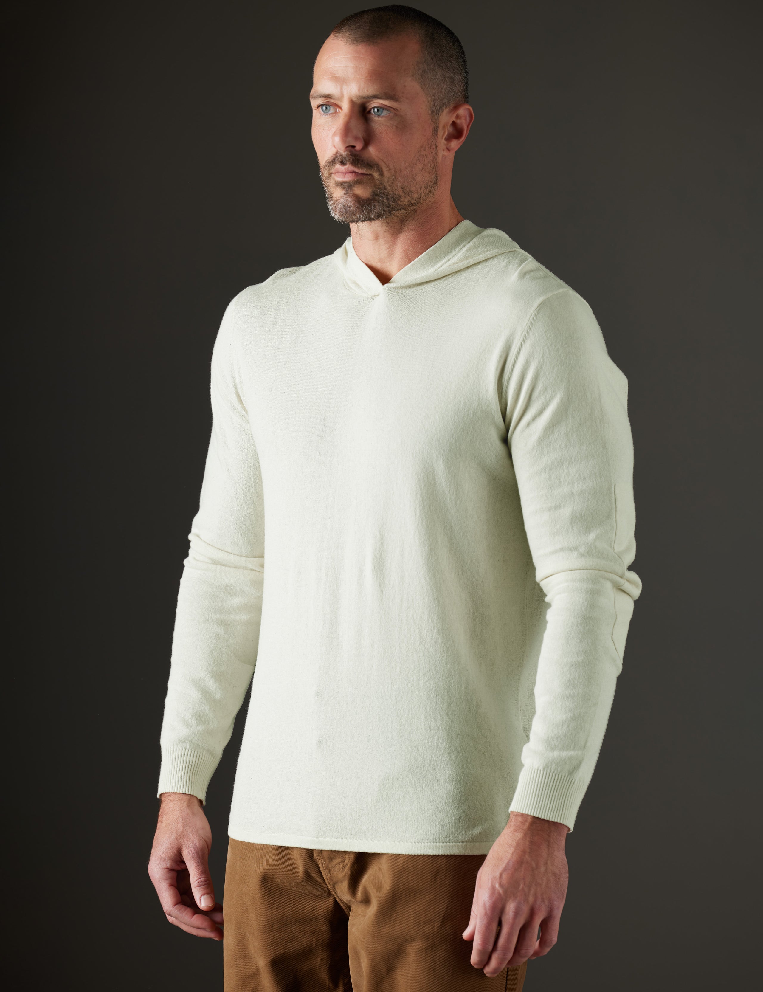 Man wearing  light green hooded sweater from AETHER Apparel