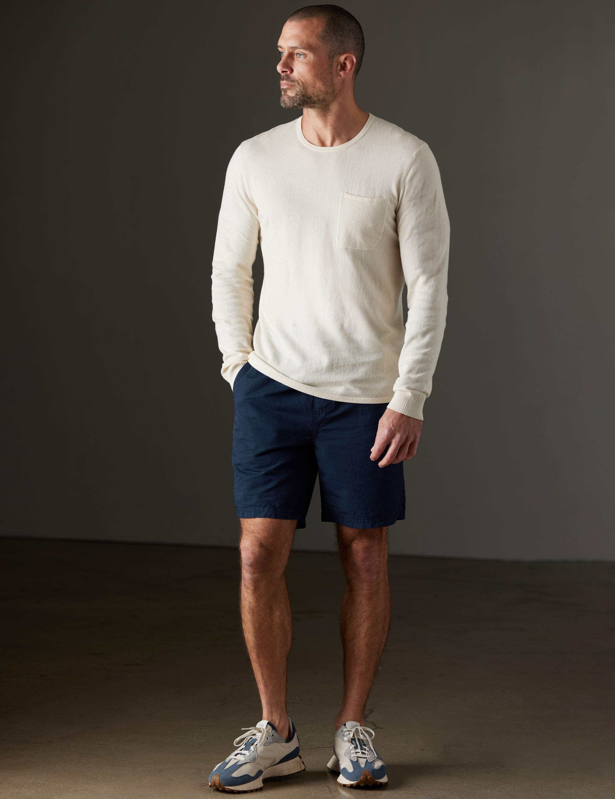 Man wearing beige sweater from AETHER Apparel