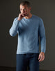 Man wearing a blue sweater from AETHER Apparel