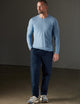 Man wearing a blue sweater from AETHER Apparel