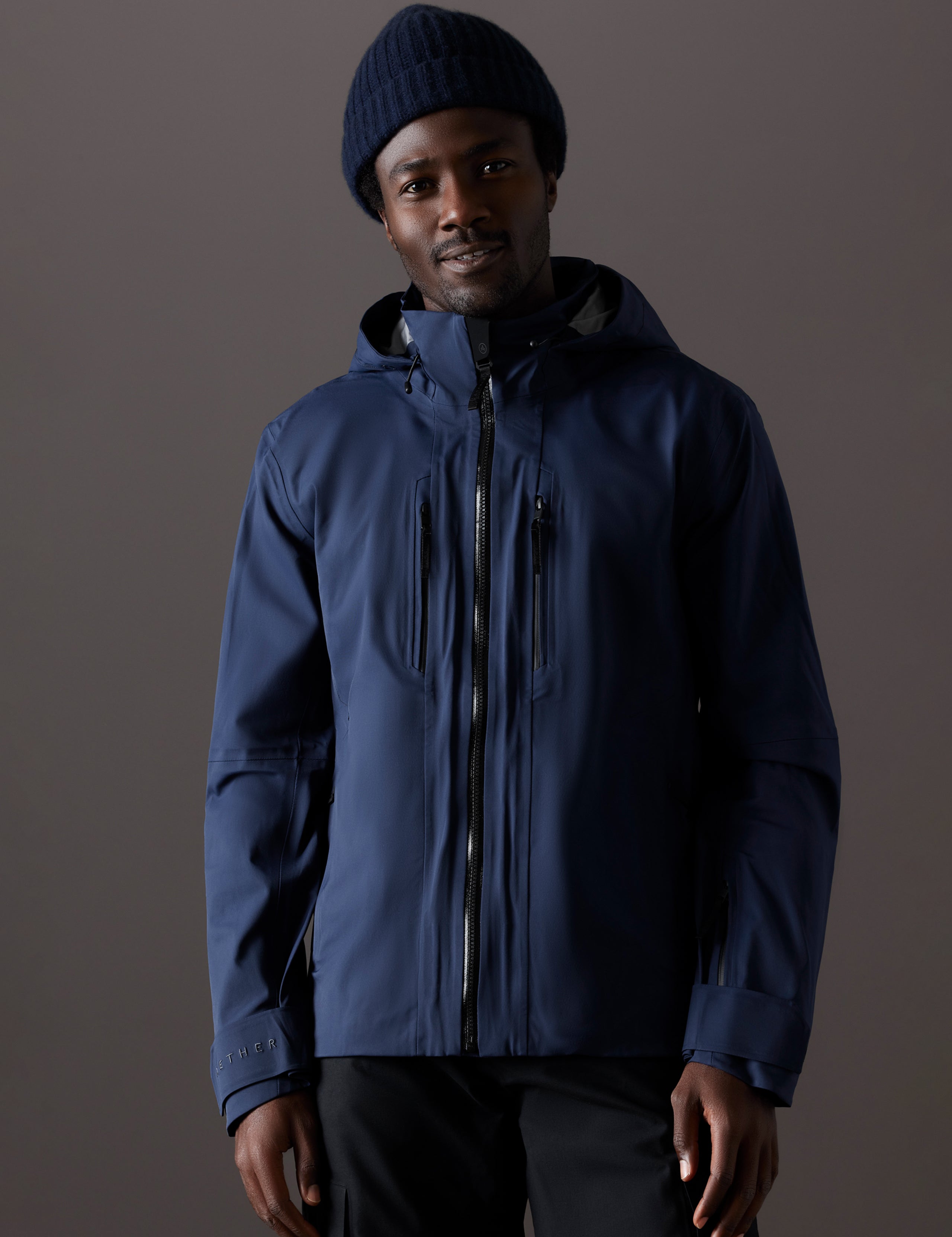 man wearing blue snow shell from AETHER Apparel