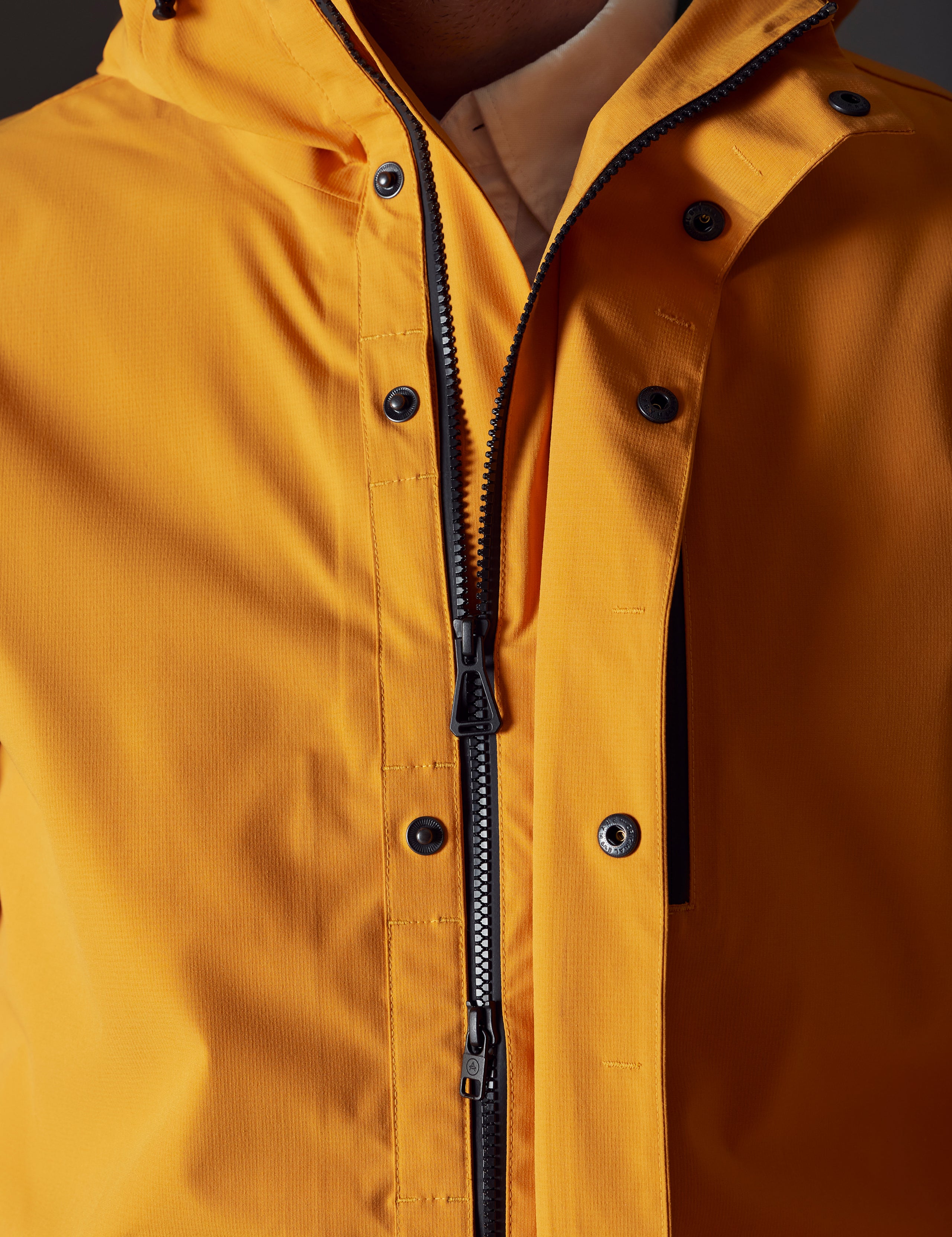 Men's orange rain jacket from AETHER Apparel