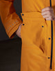 Pocket view of orange rain jacket from AETHER Apparel