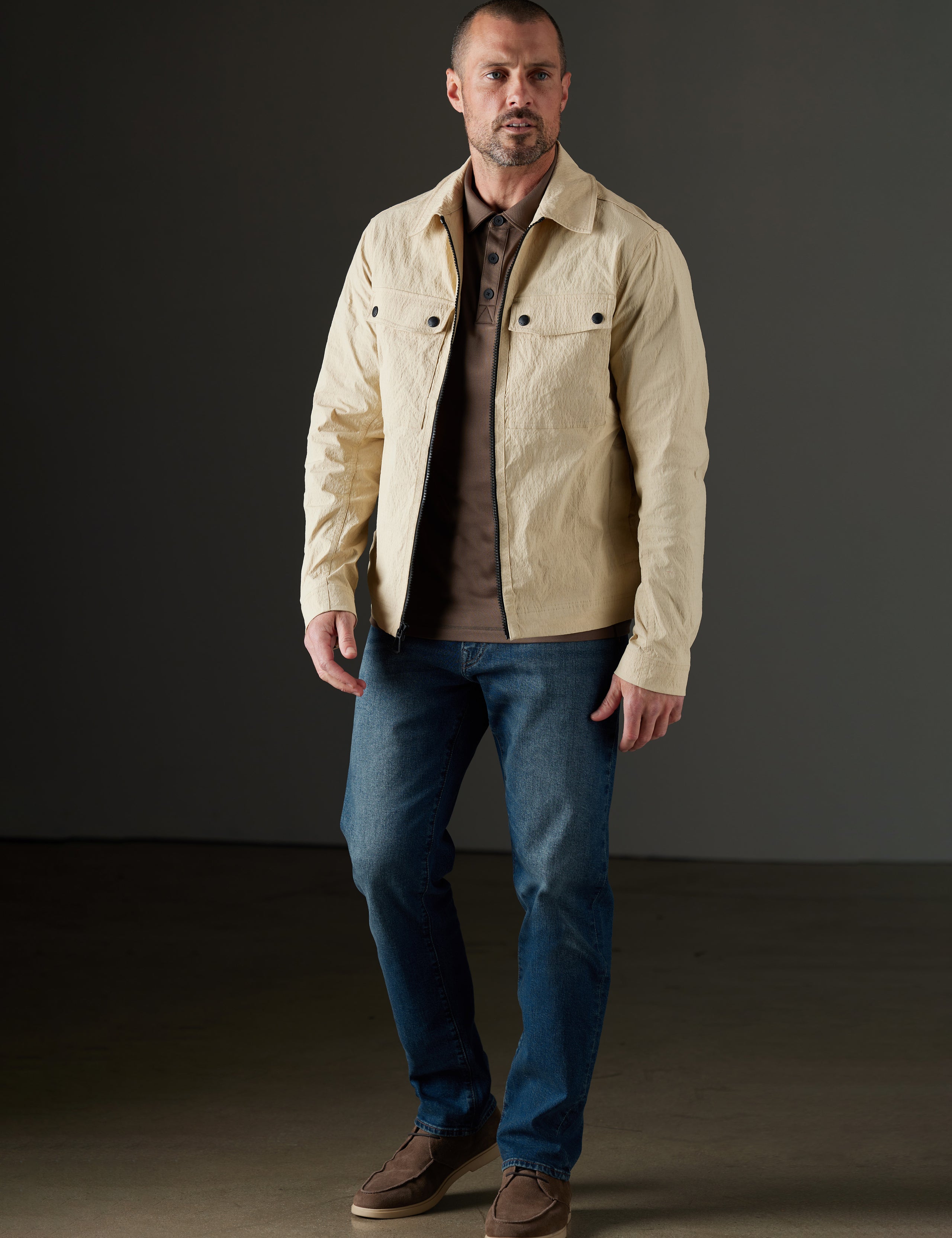 Man wearing beige jacket from AETHER Apparel