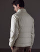 Man wearing white Eco Insulated Jacket from AETHER Apparel