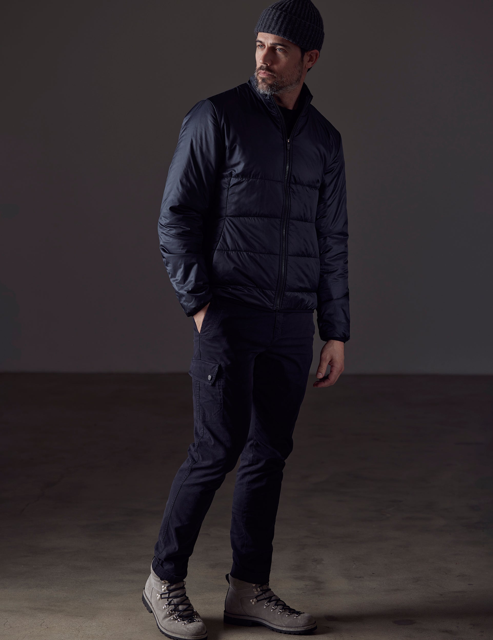 Man wearing black Eco Insulated Jacket from AETHER Apparel