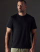 Man wearing black organic cotton tee from AETHER Apparel