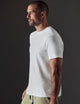 Man wearing white organic cotton tee from AETHER Apparel