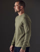 Man wearing green organic cotton tee from AETHER Apparel