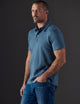 Man wearing blue organic cotton polo from AETHER Apparel