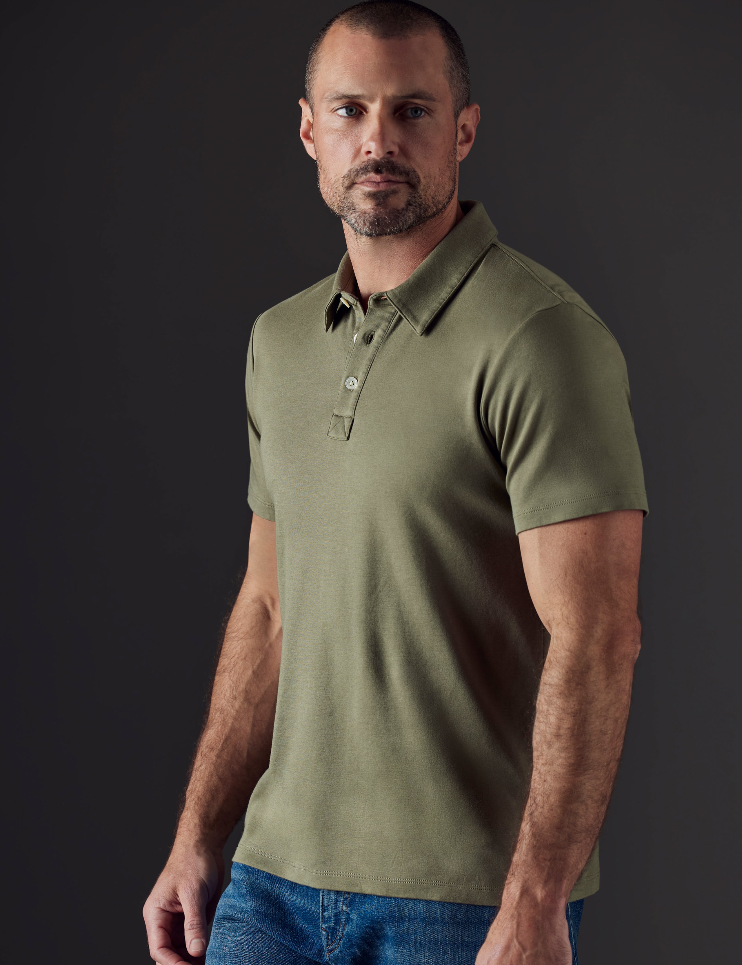 Man wearing green organic cotton polo from AETHER Apparel