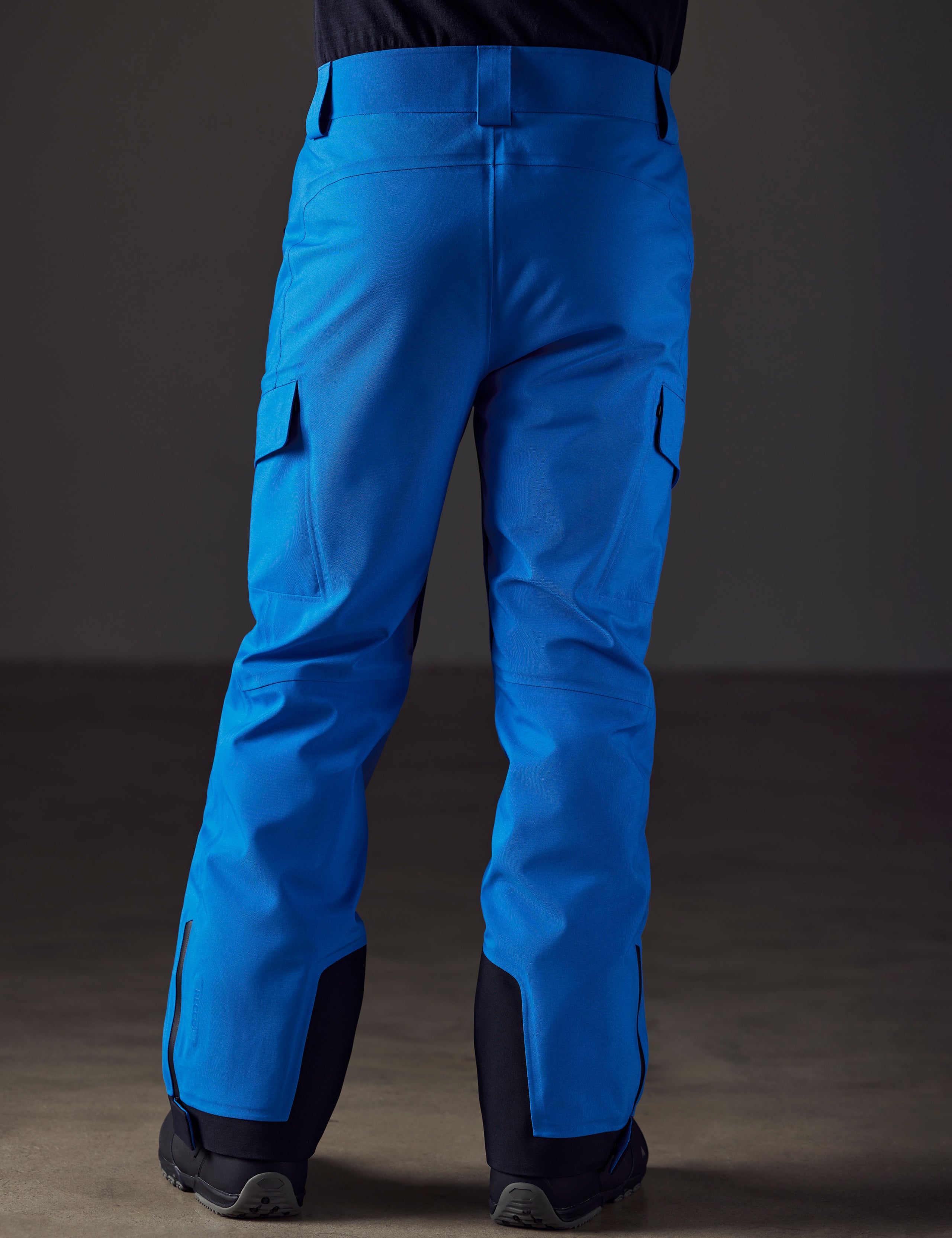 man wearing blue snow pants from AETHER Apparel
