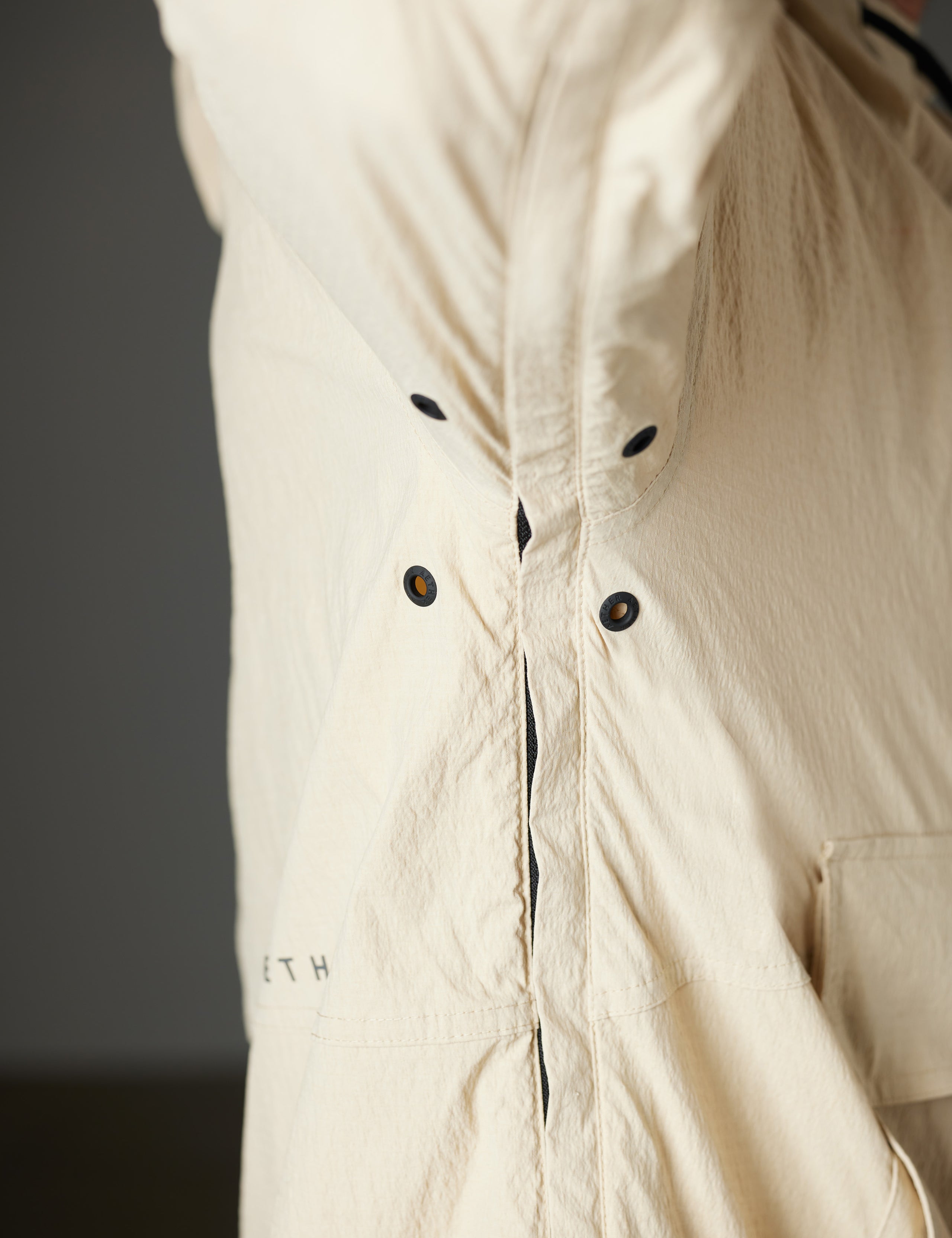 Side seam of beige anorak from AETHER Apparel