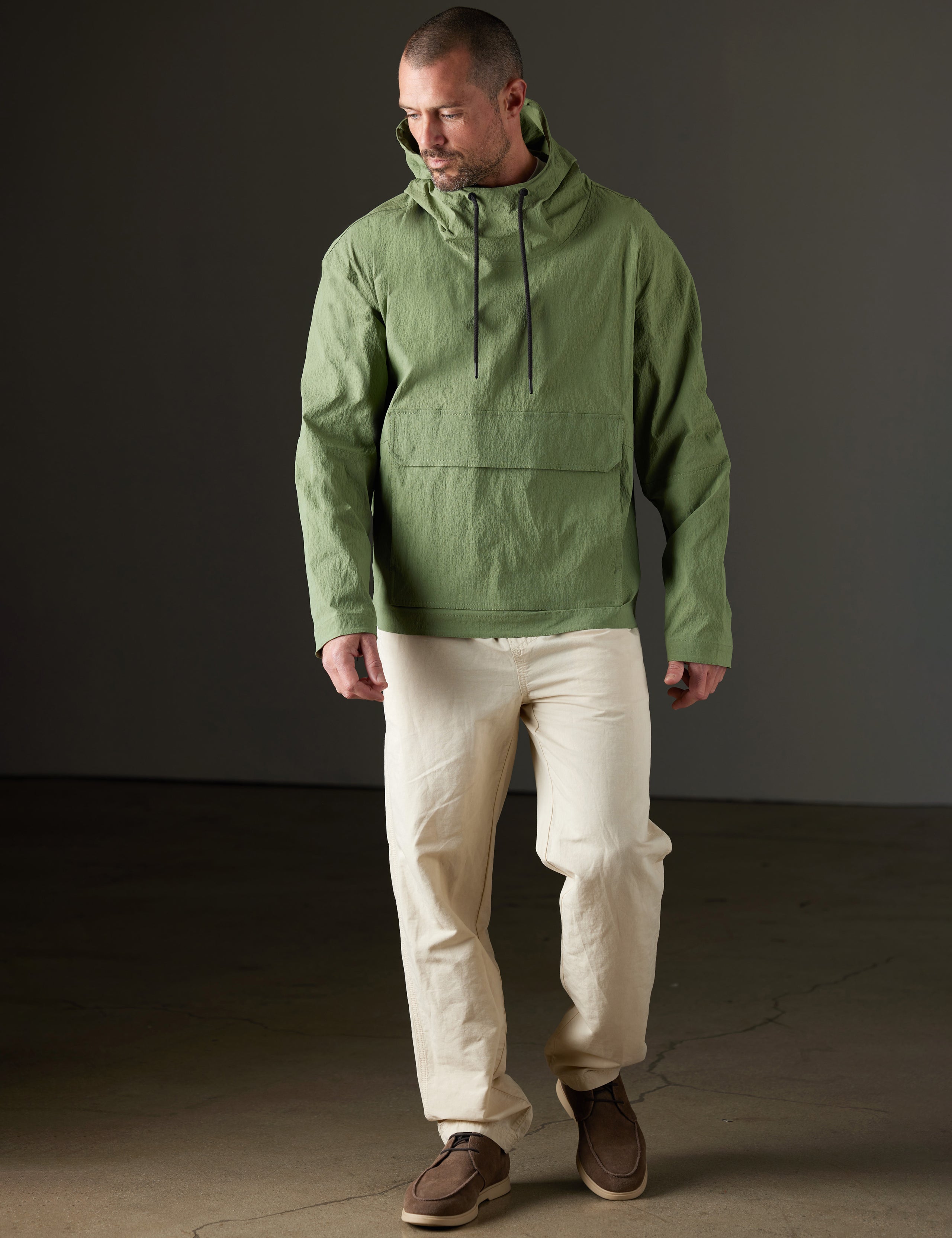 Man wearing green anorak from AETHER Apparel