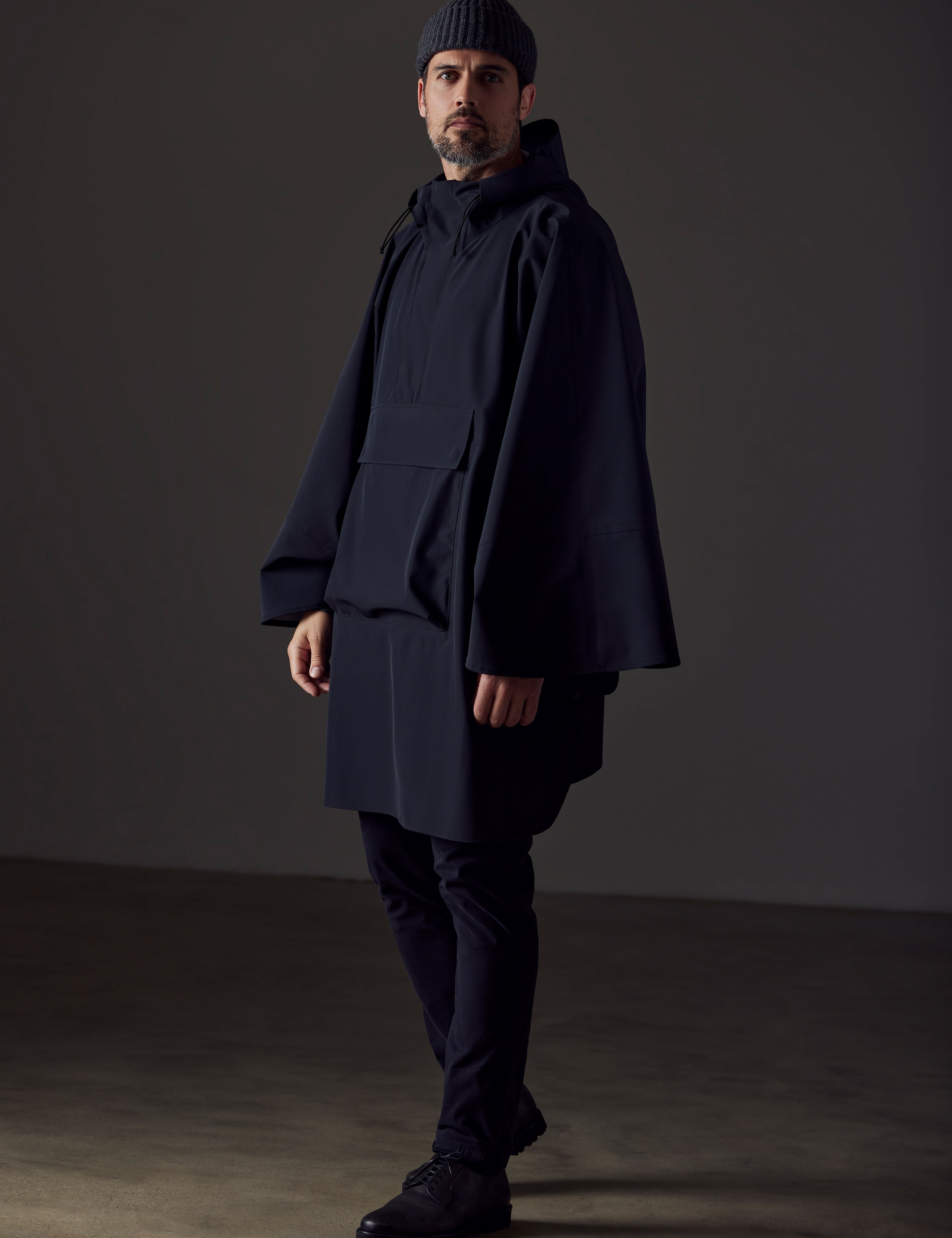 Man wearing black poncho from AETHER Apparel