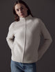 Woman wearing white sweater from AETHER Apparel