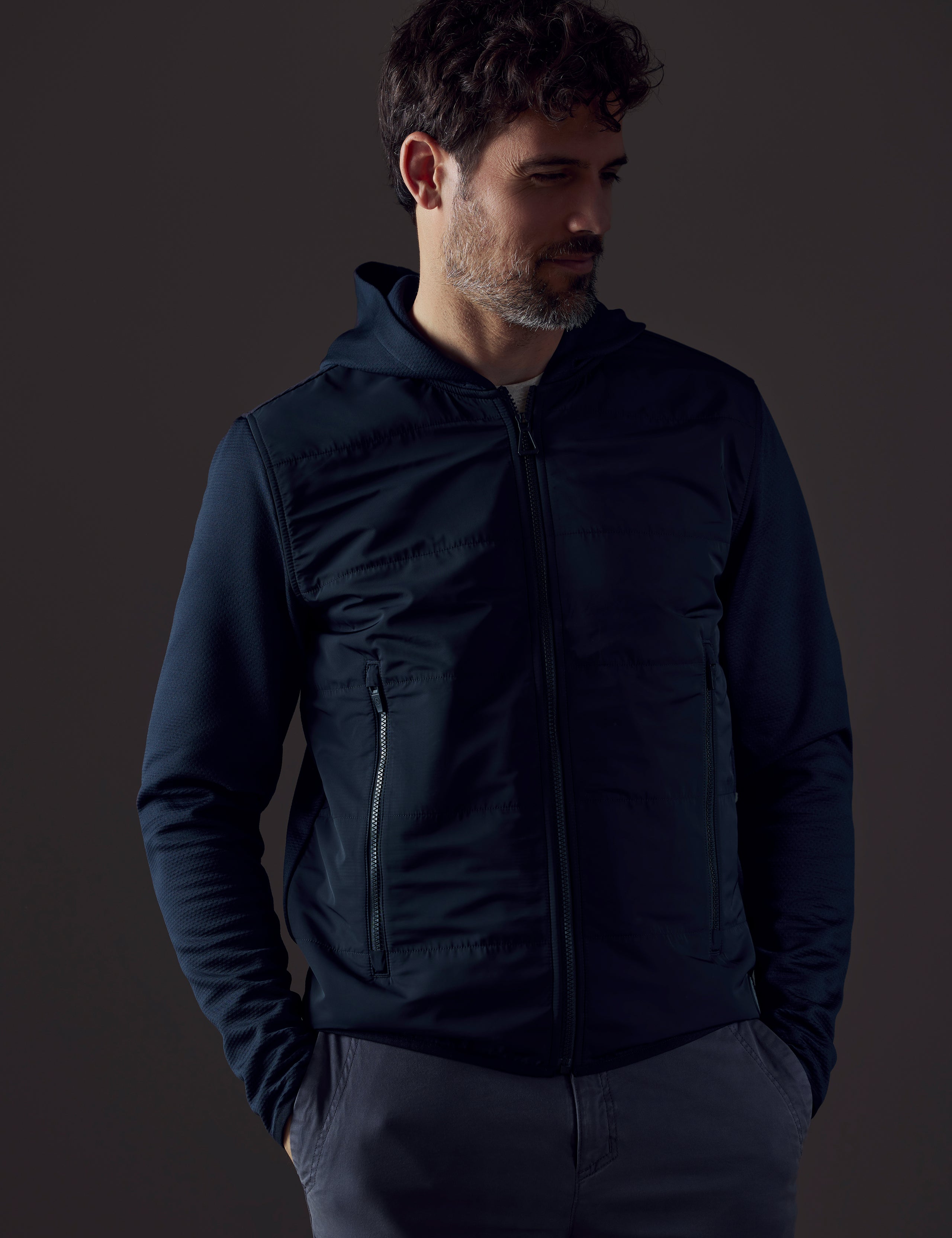 Man wearing dark blue full-zip from AETHER Apparel