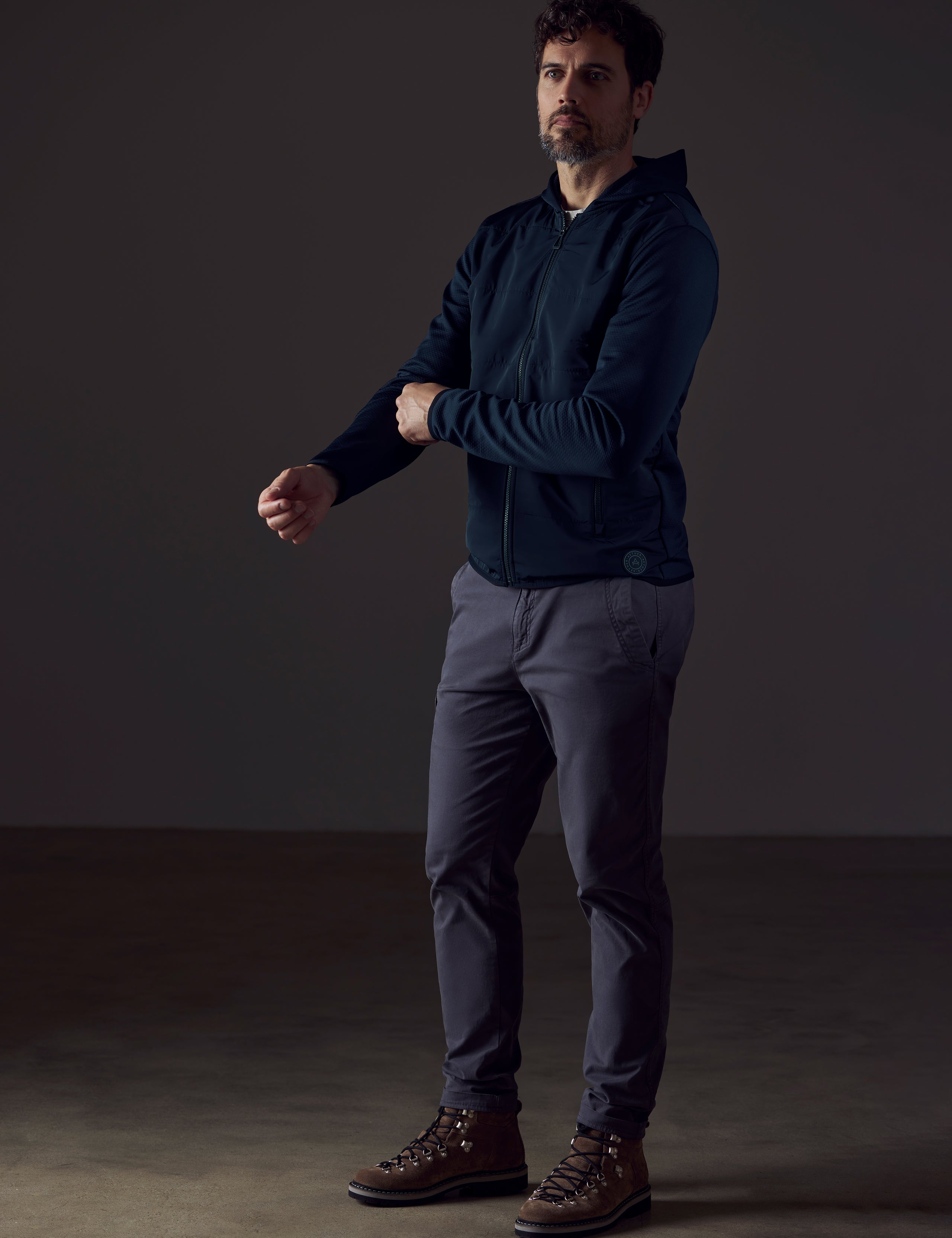 Man wearing dark blue full-zip from AETHER Apparel