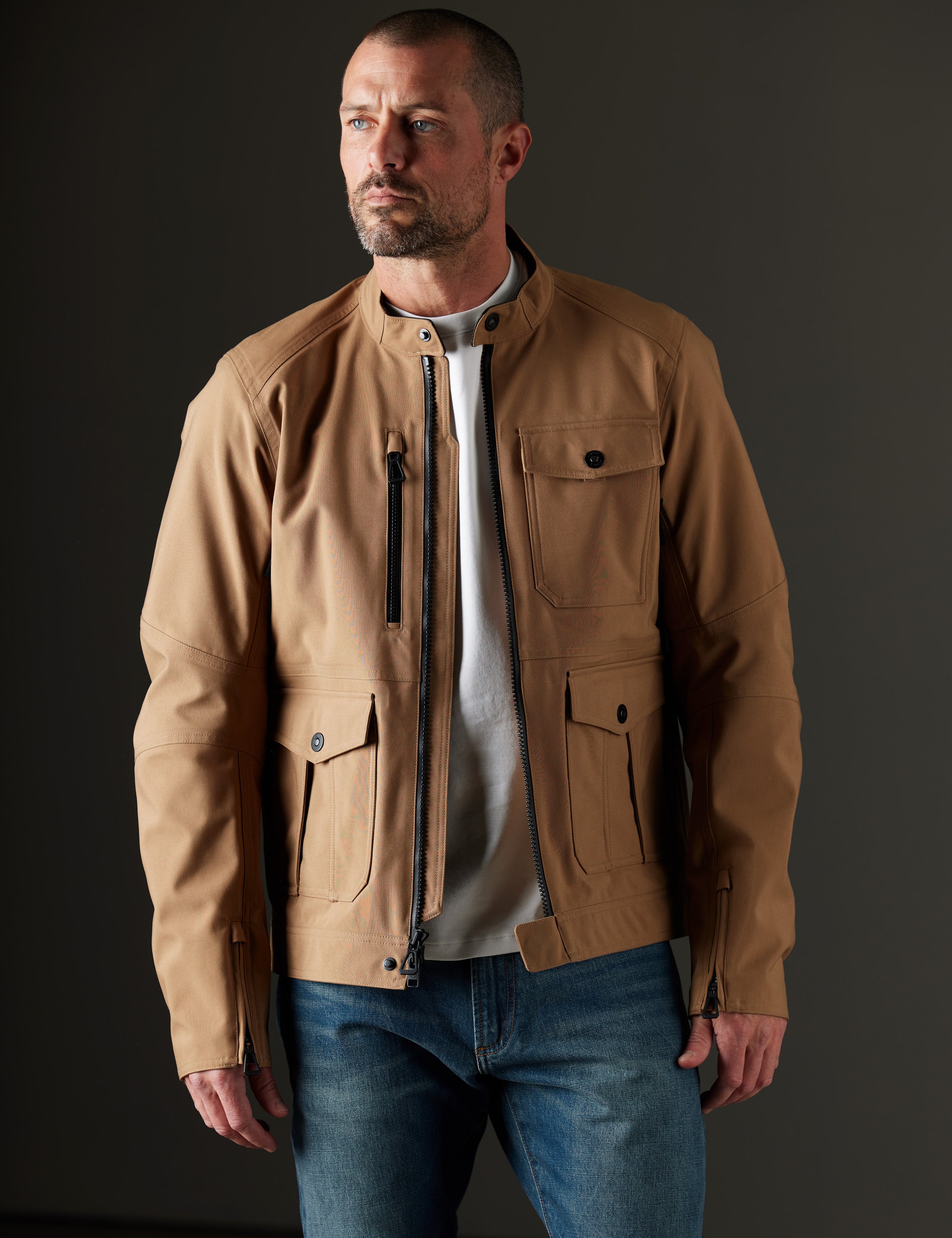 Man wearing brown motorcycle jacket from AETHER Apparel