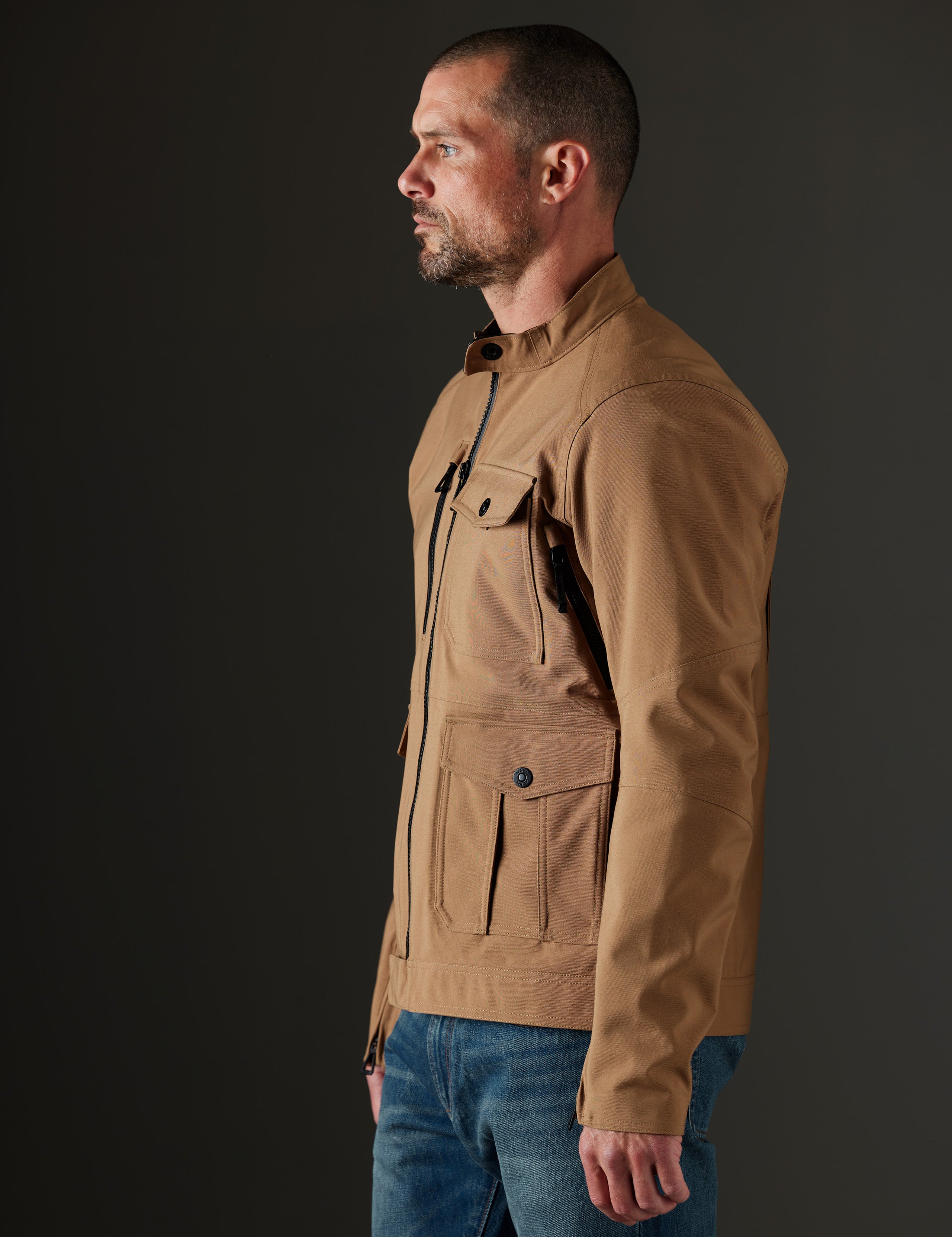 Man wearing brown motorcycle jacket from AETHER Apparel