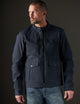 Man wearing dark blue motorcycle jacket from AETHER Apparel