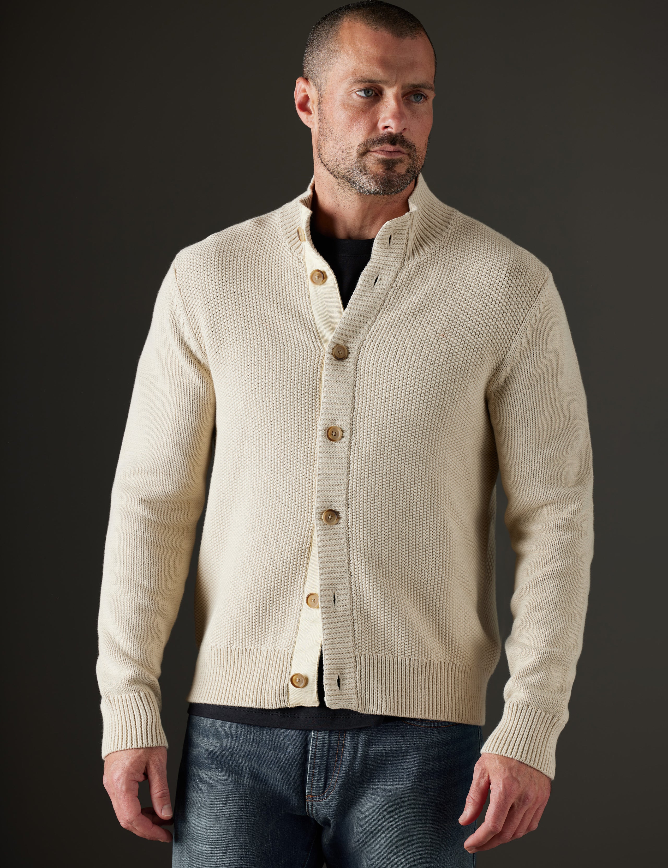 Man wearing beige sweater from AETHER Apparel