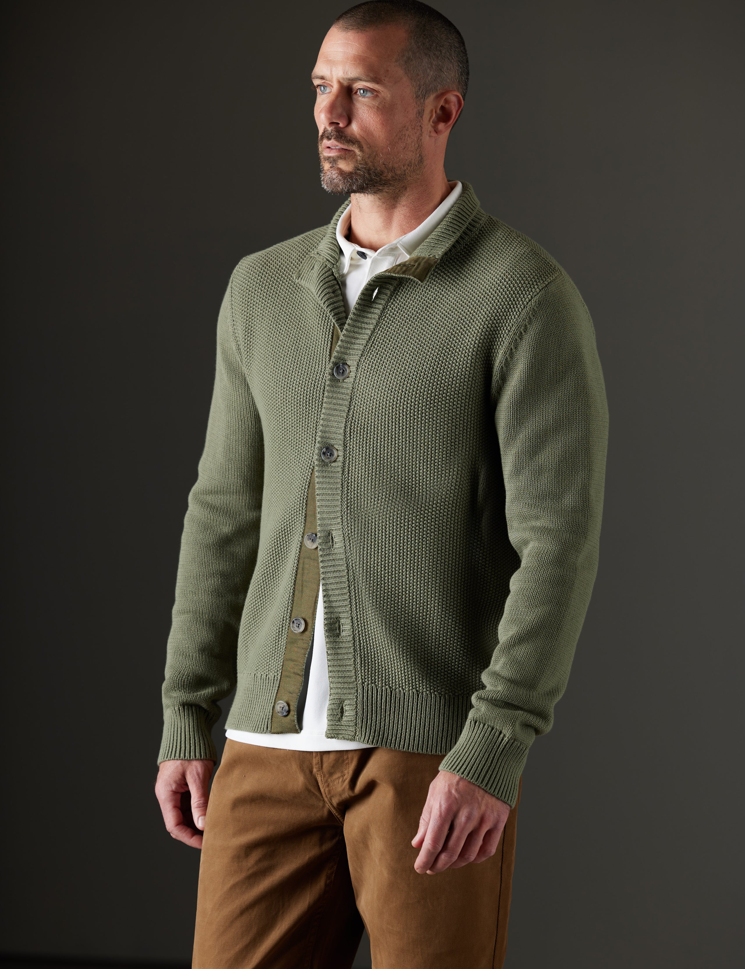 Man wearing green sweater from AETHER Apparel