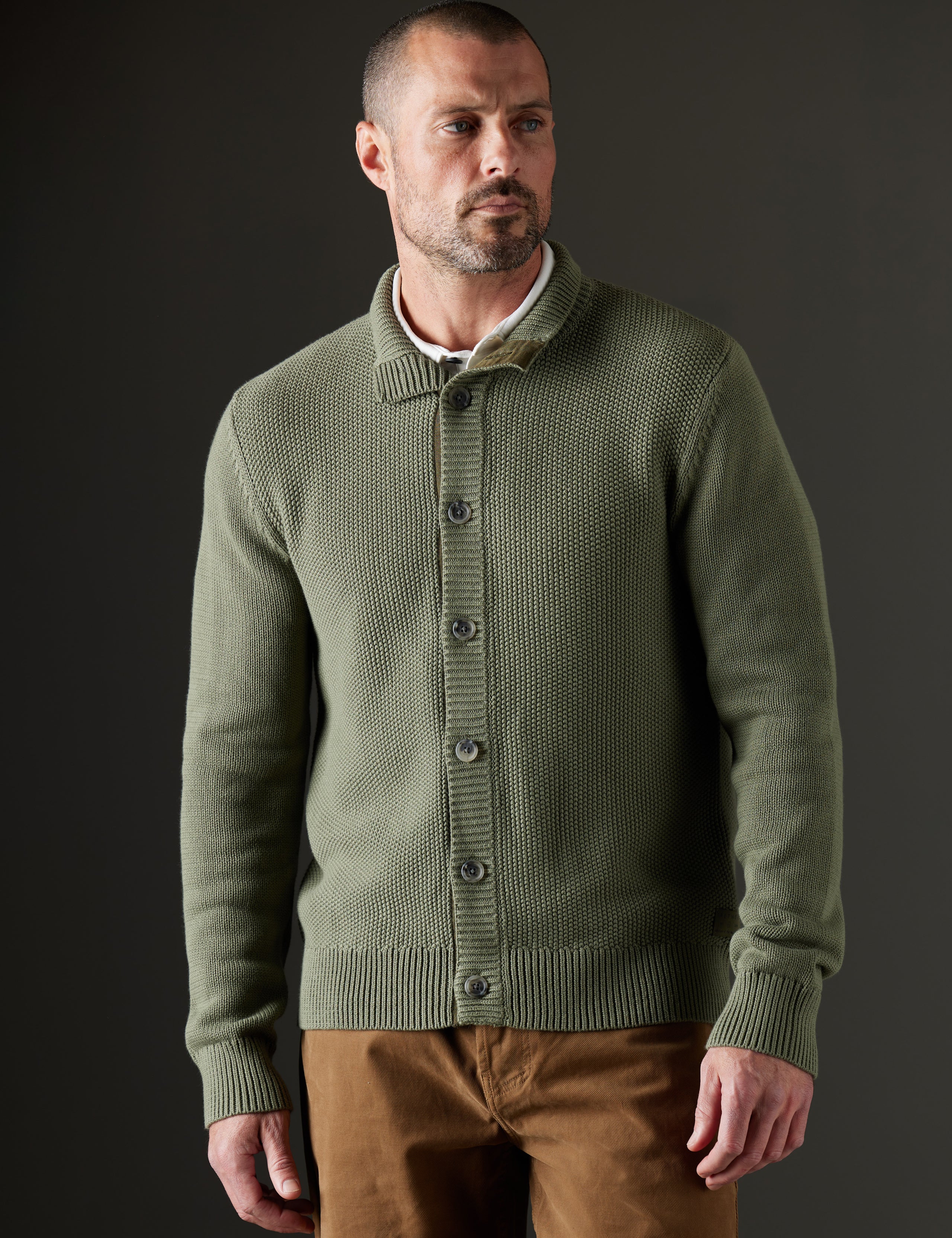 Man wearing green sweater from AETHER Apparel