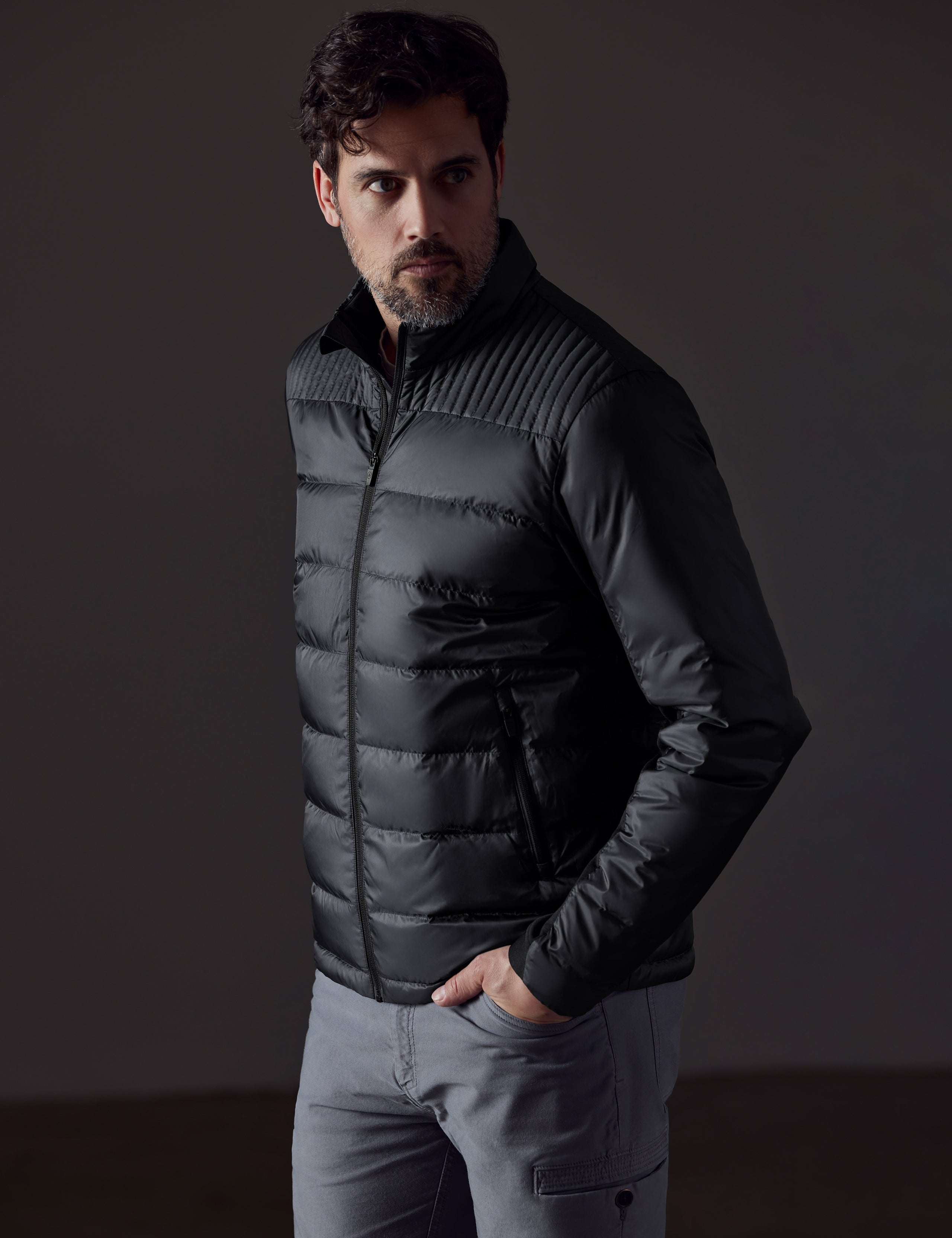 man wearing a black insulated jacket from AETHER Apparel