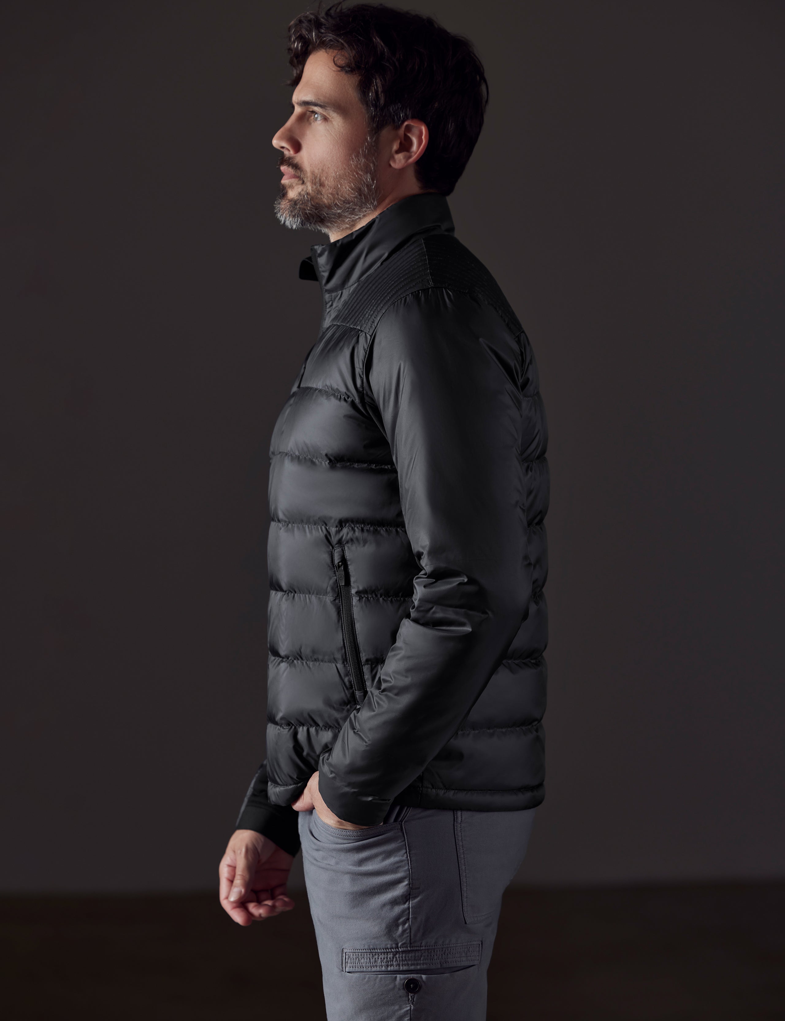 man wearing a black insulated jacket from AETHER Apparel