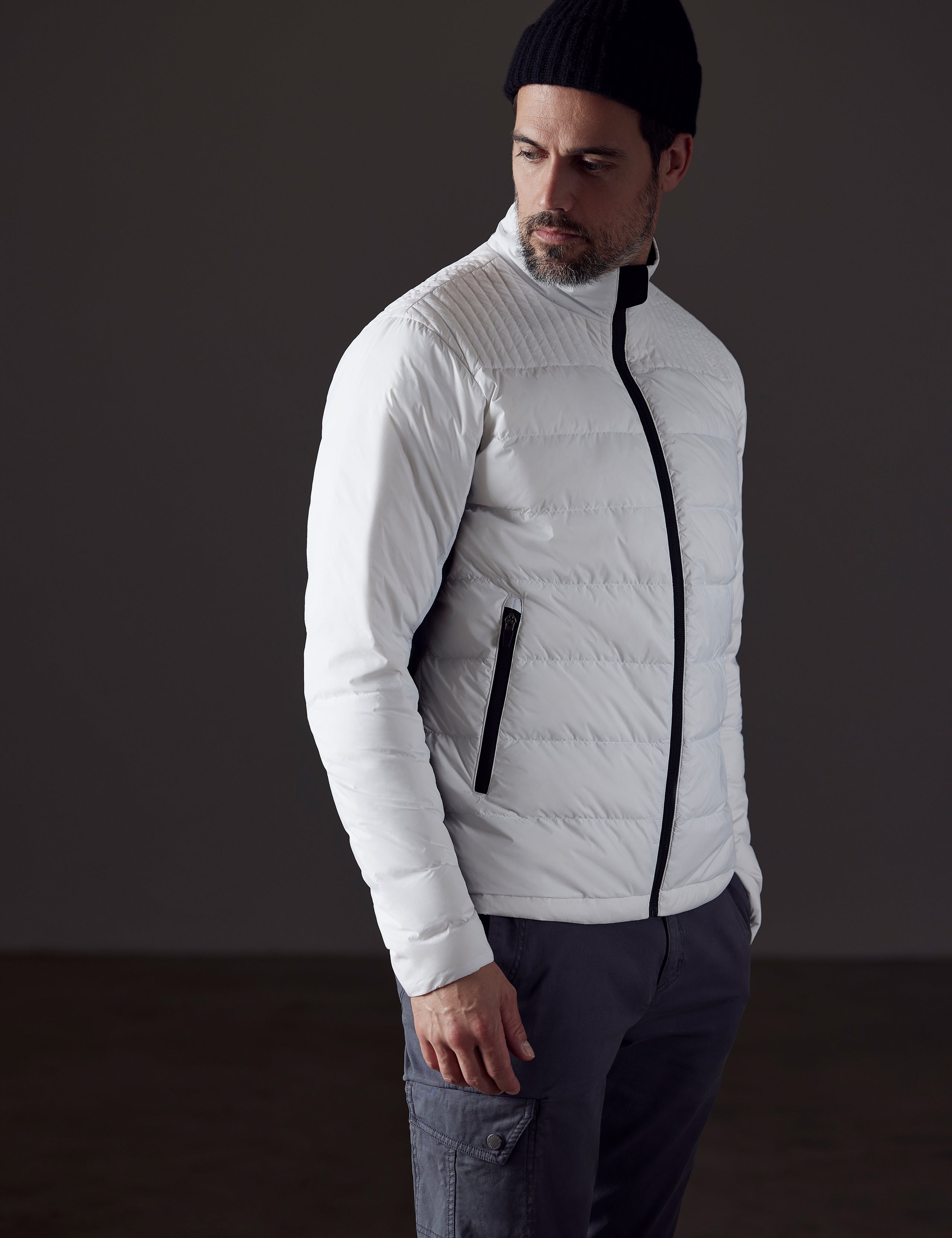 man wearing a white insulated jacket from AETHER Apparel