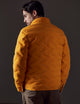 Man wearing orange insulated jacket from AETHER Apparel