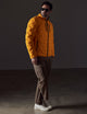 Man wearing orange insulated jacket from AETHER Apparel