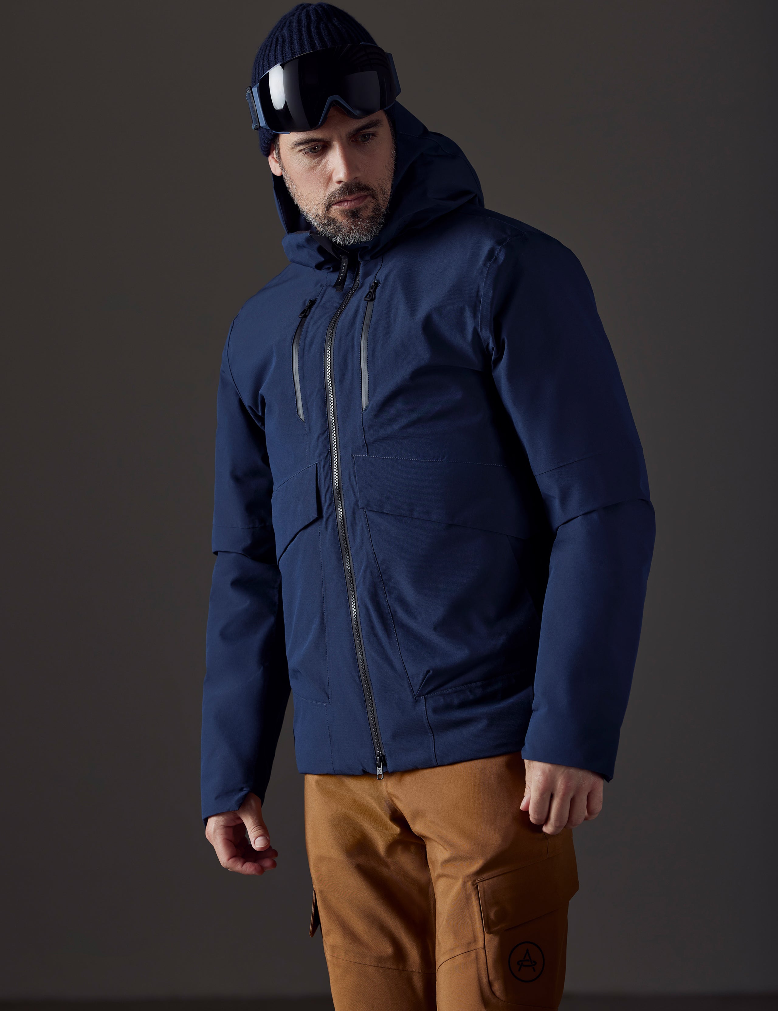 man wearing blue insulated jacket from AETHER Apparel