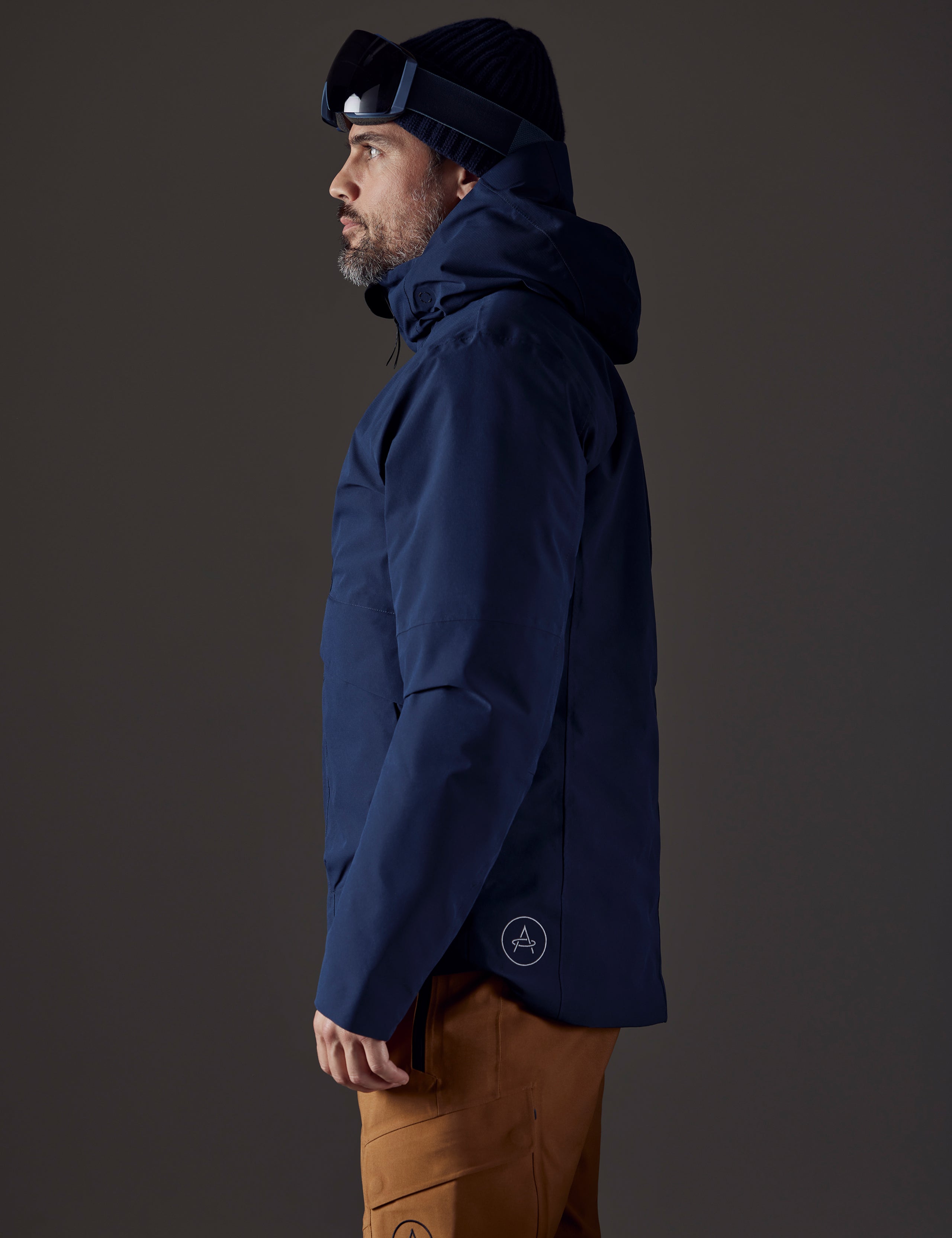 man wearing blue insulated jacket from AETHER Apparel