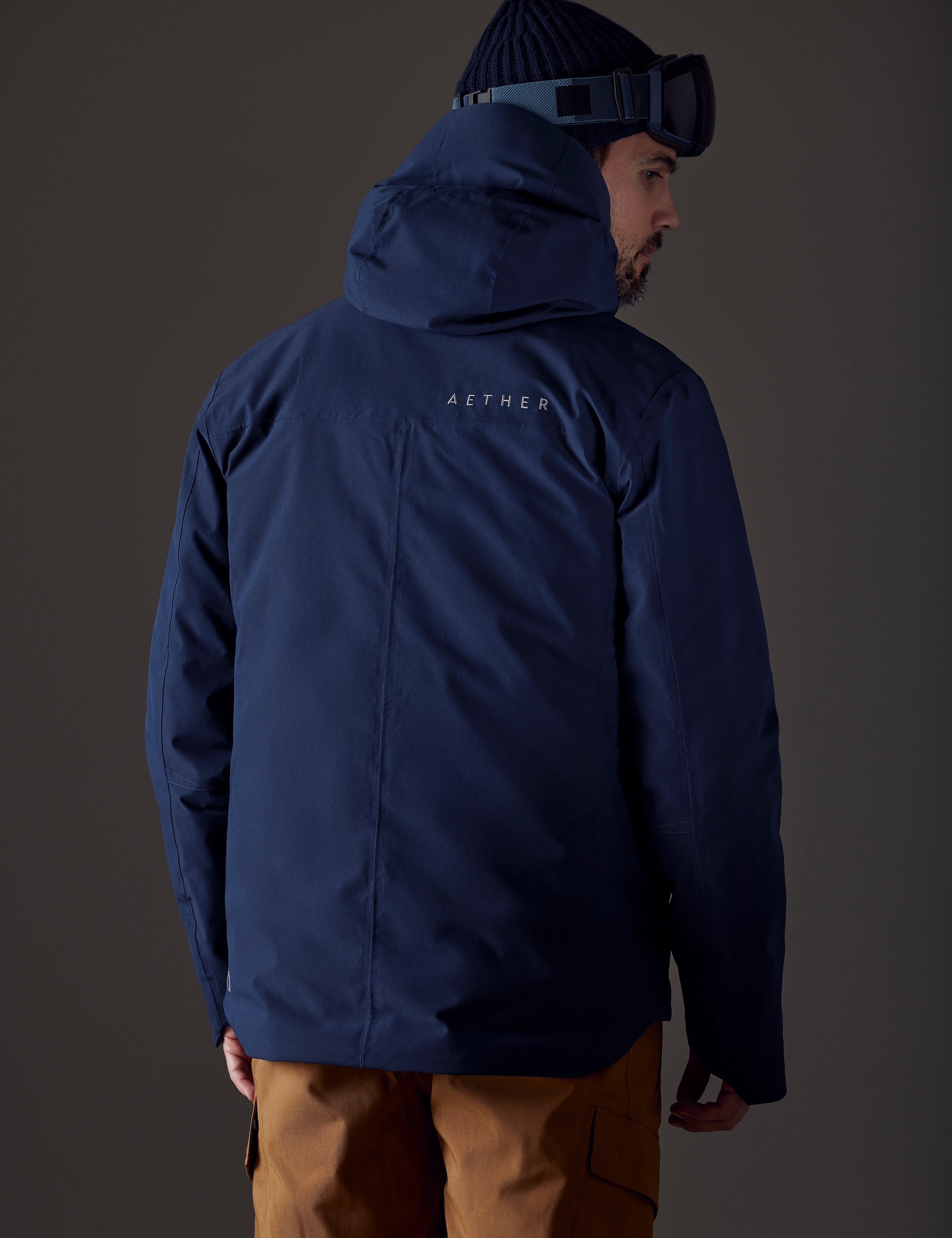 man wearing blue insulated jacket from AETHER Apparel