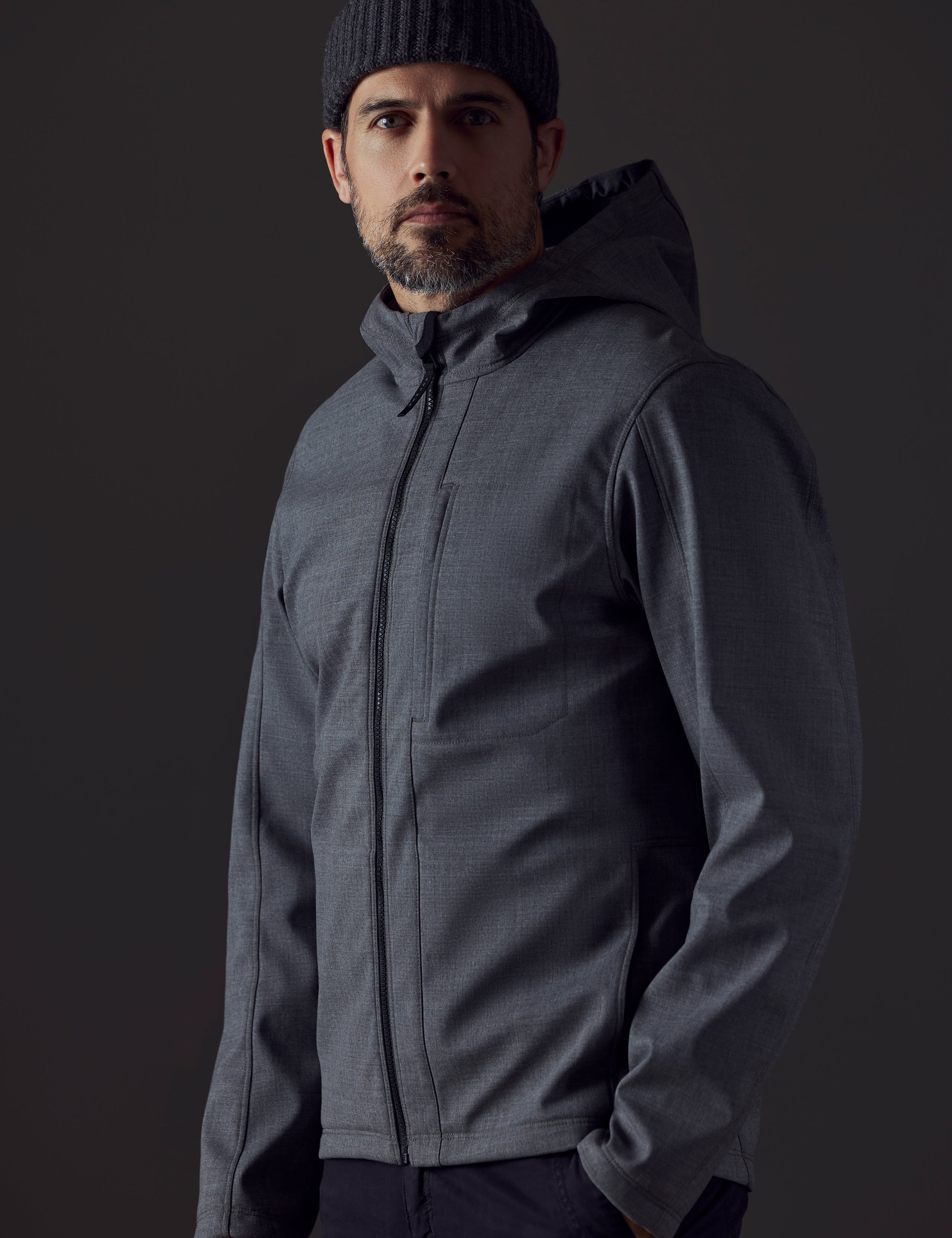 Man wearing grey technical jacket from AETHER Apparel