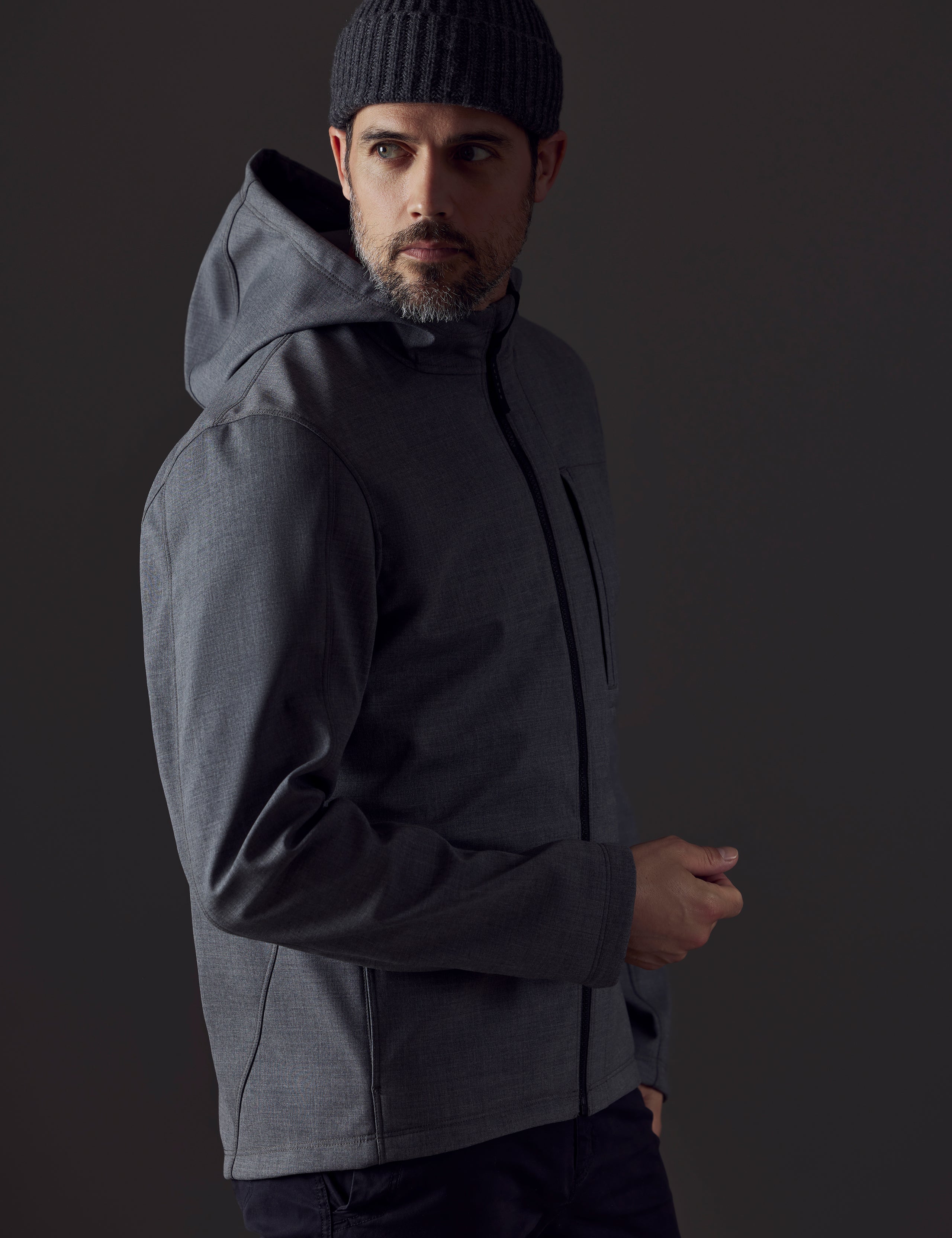 Man wearing grey technical jacket from AETHER Apparel