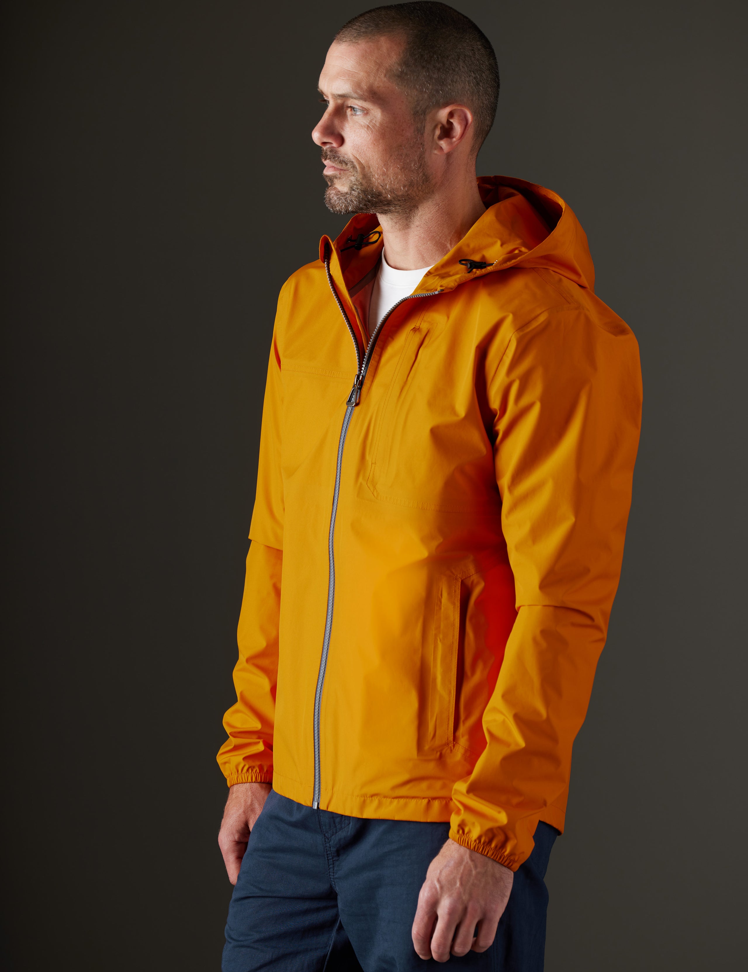 man wearing orange jacket from AETHER Apparel