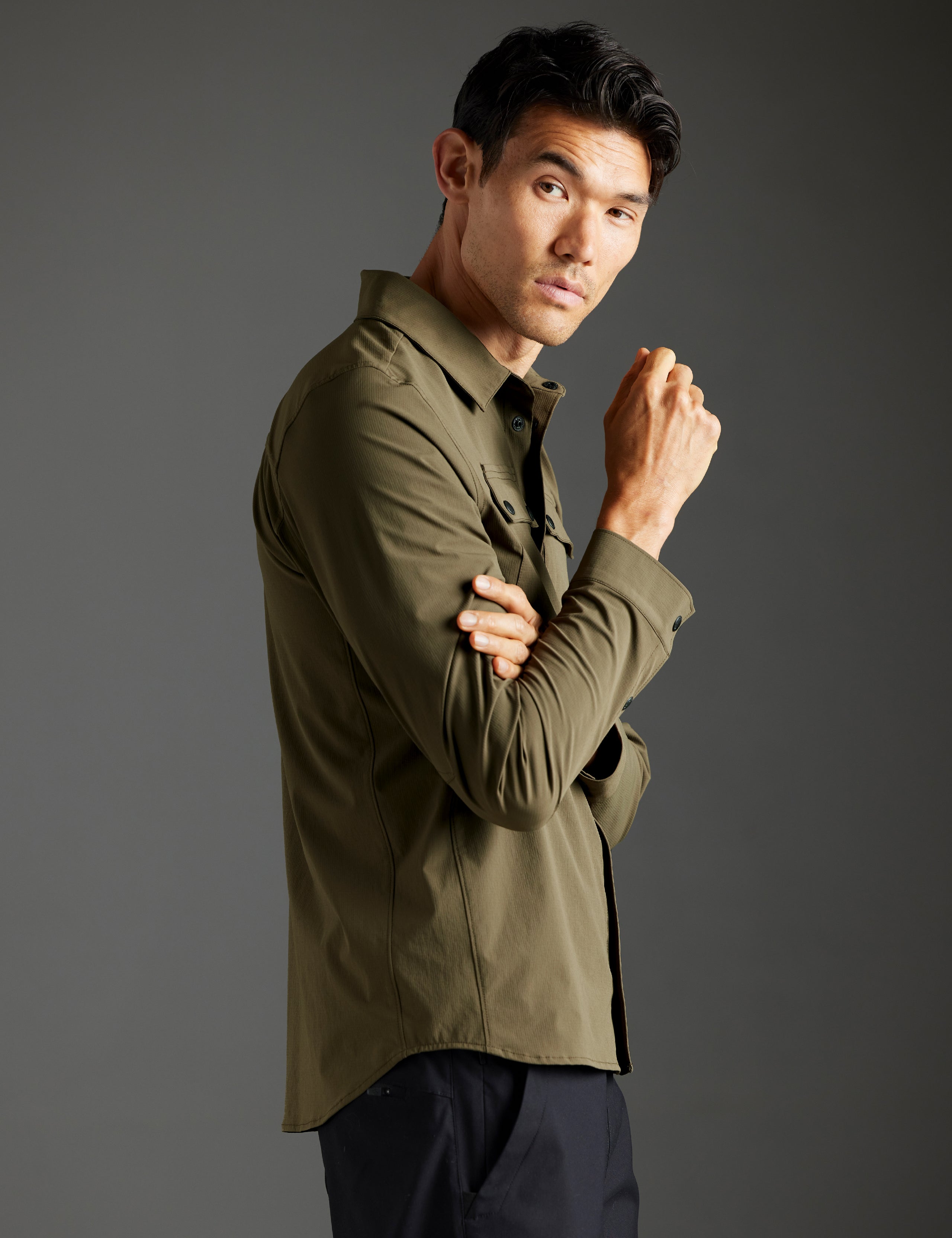 man wearing green button down from AETHER Apparel