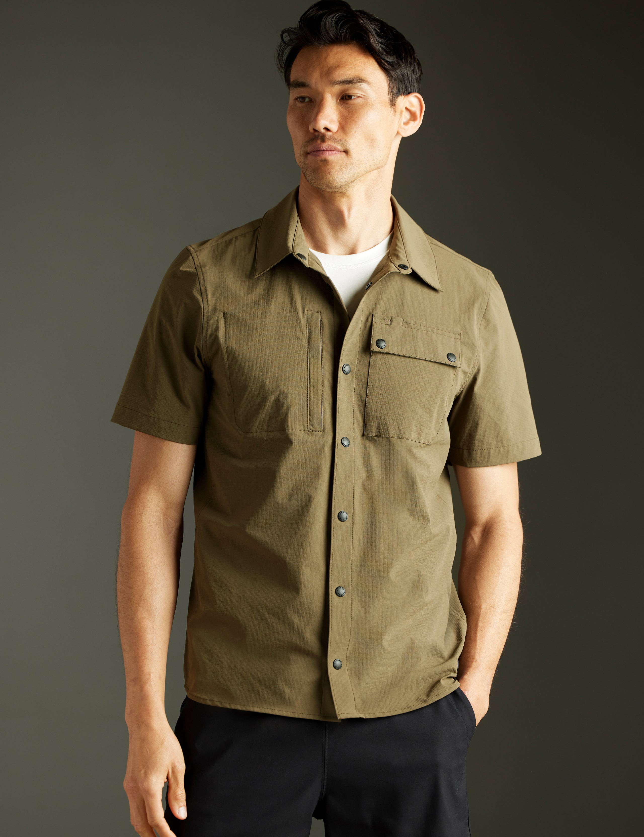 man wearing green short-sleeve button down from AETHER Apparel